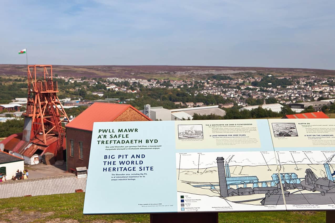 A view from above Big Pit National Coal Museum, Blaenavon, with an information sign board in the foreground.